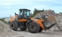 Quick movement of dirt and aggregate on the recycling yard is done by a Case 821G wheel loader.   (CEG photo)