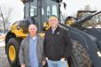 Stanley Mierzejewski (L), president of Mizzy Construction, and Matt LaDuke, sales representative of W.I. Clark, with a recently purchased John Deere loader.   (CEG photo)
