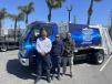 Ray Gaskin Service, a supplier of waste collection bodies, exhibits the zero emission waste collection vehicle.  (L-R): Ron Creighton, fleet, municipal salesman of Velocity Truck Centers; Bobby Ziello, sales manager of Ray Gaskin Service; and Brandon Schutte, product support manager of Velocity Truck Centers.   (CEG photo)