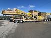 A two-bin portable pugmill plant headed to a highway job in Georgia.   (Photo courtesy of Pugmill Systems LLC)