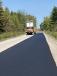 The town of Eden highway department paved its last dirt road, Eden Evans Townline Road, with the help of some neighboring towns.   (Eden Highway Department photo)