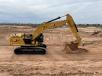 A Cat 374 excavator moves dirt on the future site of Tucson’s Mosaic Quarter.   (Granite Construction photo)
