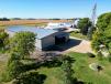 A drone's-eye view of the large bifold door wide open, with a distant glimpse of the Thalmann Seed farm on the horizon.   (Schweiss photo)
