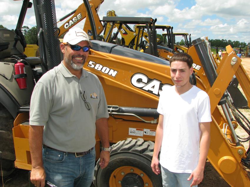 At the auction to buy multiple machines to satisfy the needs of their customers back in Puerto Rico are Kiki Brignoni (L) and his son Jose, of Heavy Equipment Inventory, based in Puerto Rico.