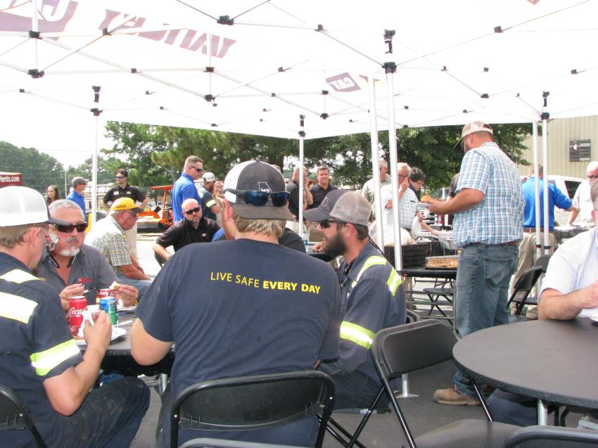 Guests relax and unwind with their Yancey and Sitech representatives over a barbeque lunch. 