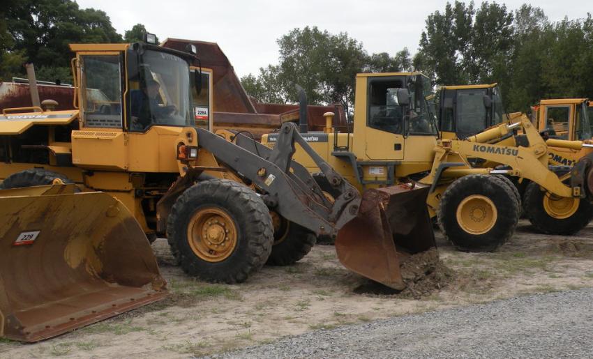 Komatsu WA250 wheel loaders are lined up and waiting for new homes.