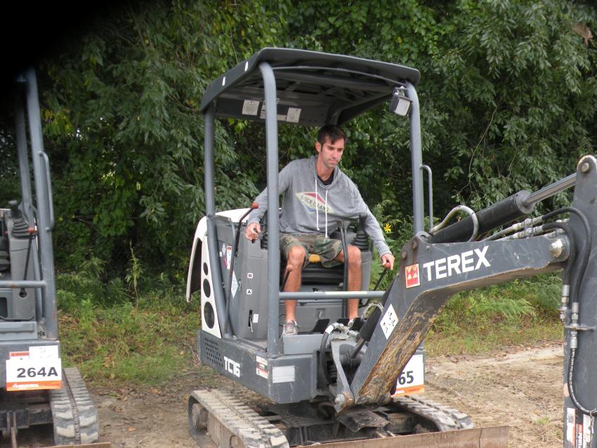 Ryan Dehler, a homebuilder of RD Homes, Scotland, Conn., tests out a Terex TC16 mini-excavator.