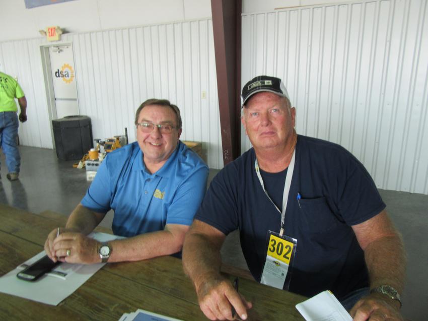 Interstate Machinery’s Steve Hendrickson (L) joined Gary Call of Call Excavating to take in the auction activities.
