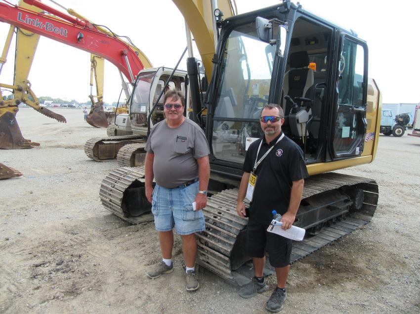Jeff (L) and Kevin Melton of Melton Excavating were on the hunt for attachments at the auction.
