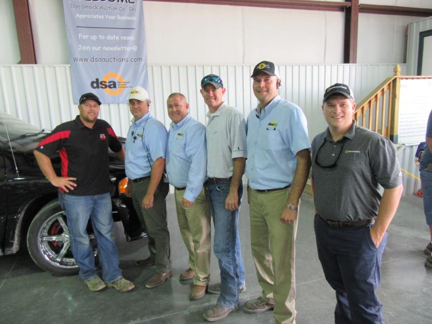 (L-R): Brandon Buck of 3D Compan; Don Smock Company’s John Hosier and Nic Smock; Brandeis Machinery & Supply Company’s Ken Peterson;  Mark Woodward of Don Smock; and Mack Morris of Brandeis caught up at the auction.
