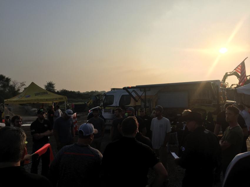 Skid steer drivers meet before the final round for the top 10 qualifiers. 
