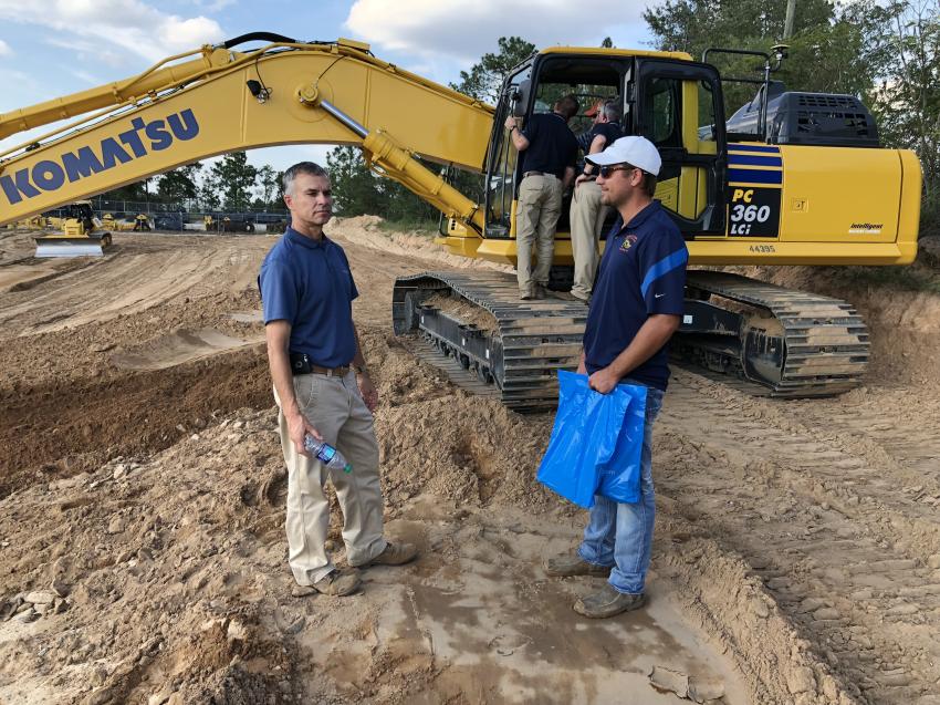 Zvi McManus (L) of Linder Industrial Machinery goes over the new Komatsu PC360i with Stephen Balentine of Gene Ray Fulmer Construction Co. in Ridge Spring, S.C. The machine utilizes 3D design data loaded into a monitor to accurately display machine position relative to target grade. When the bucket reaches the target surface, automation kicks in to limit over-excavation.
