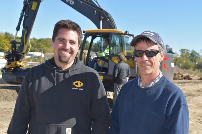 Adam Lampron (L) of Chadwick-BaRoss and Dan Caron of D.R. Caron Excavation, Finot, Maine. Caron is interested in the Engcon’s versatility. “I’ve seen it before but never operated one. Being able to put the bucket backwards has a huge advantage. Fewer laborers, less labor … also fewer operators because with this you can put materials in places where before it was hard to get it there.”