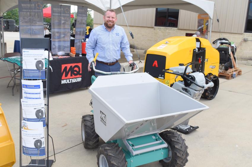 Kyle Murphy, district sales manager of MultiQuip, displays his company’s dumper that recently made its debut.