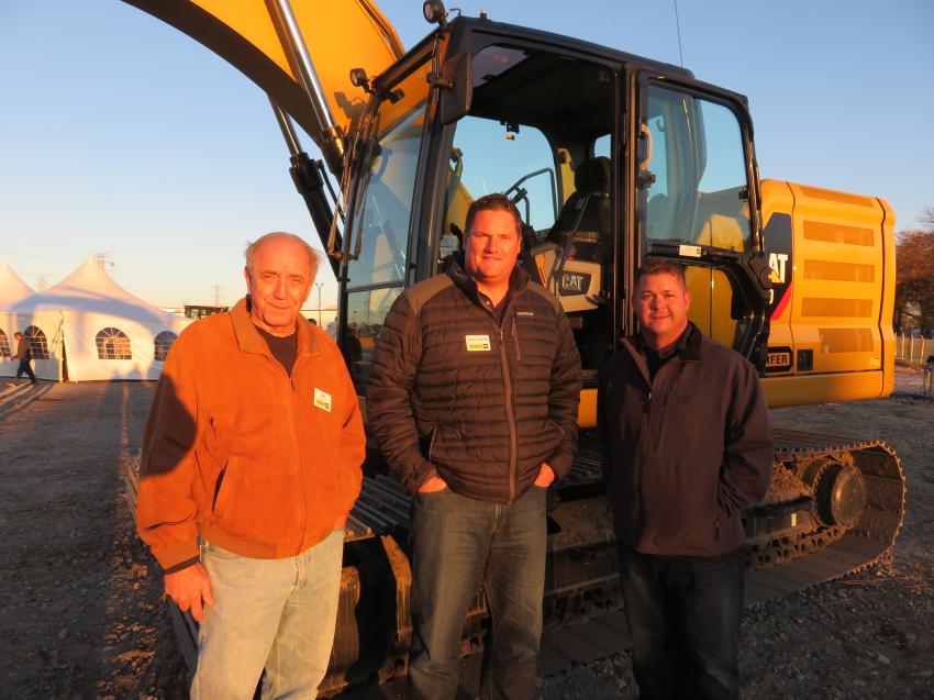 (L-R): Jim Vukelich, Altorfer CAT; Craig Robeen, vice president, sales and marketing, Altorfer CAT; and Jim Hager, Hager Excavating, stand in front of the Cat 320 Next Generation excavator. 
