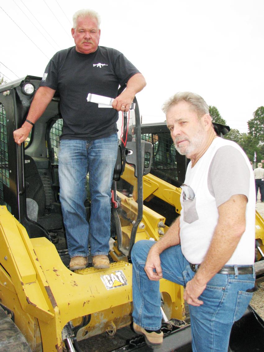 Wrapping up their inspection of a Cat compact track loader are Harold Brock (L) and Larry Helms of Brock Landscaping Contractors, Piedmont, S.C. 
