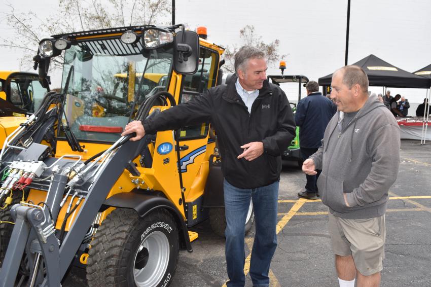Wille is a popular machine manufactured in Connecticut specifically designed for a wide variety of urban applications, including snow removal, street sweeping, pressure washing and more. Mark Fisher (L), VP Sales of Wille North America, talks about the machine with David Gagne of Longstone Corporation in Leominster, Mass.