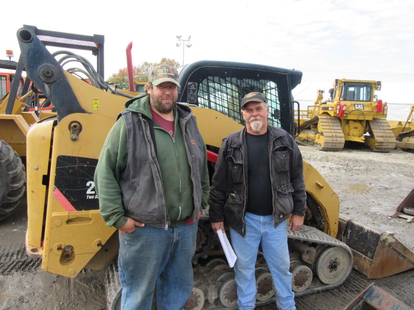Local contractor, Ted Foster (L), Foster Landscaping, who purchased a dozer, joined fellow contractor Ron Lester of Ron Lester Excavating, who was interested in trucks and trailers at the auction.