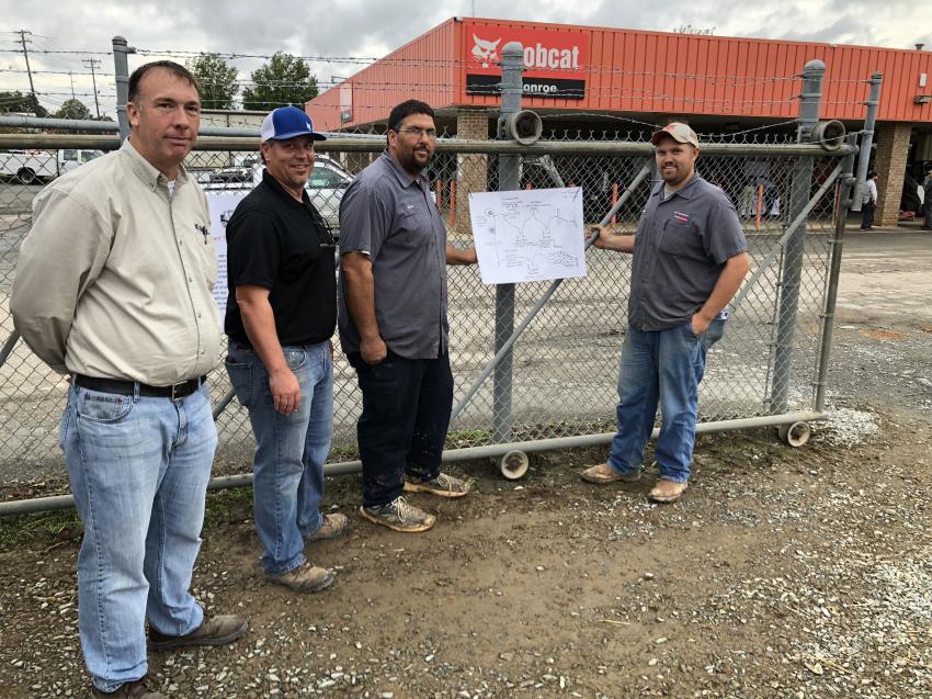 (L-R): Randy Warrington and Dan Debe, both of Bobcat of Monroe, go over the obstacle course map with Chris Morris and Jonathan Couick of New Dimensions Outdoor Services in Indian Trail, N.C.