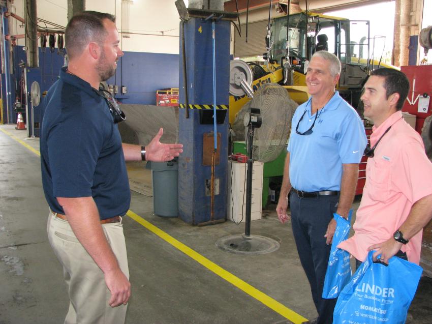(L-R): Linder’s Jason Heim provides a tour of the Pembroke Pines facility for Iggy Halley (c) and Daniel Halley (r) of Halley Engineering Contractors, Miami. 