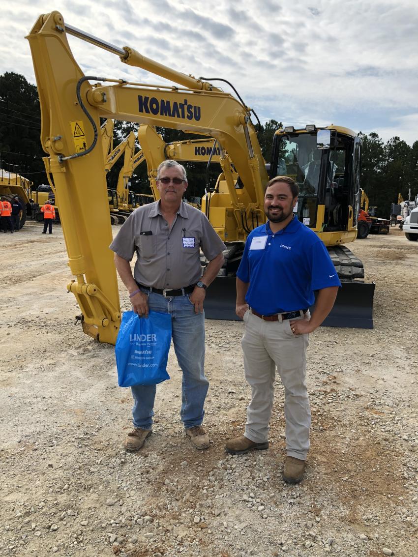 Going over the wide assortment of Komatsu excavators are Kevin Gonyea (L) of East Coast Drilling in Wake Forest, N.C., and Owen Smith of Linder.