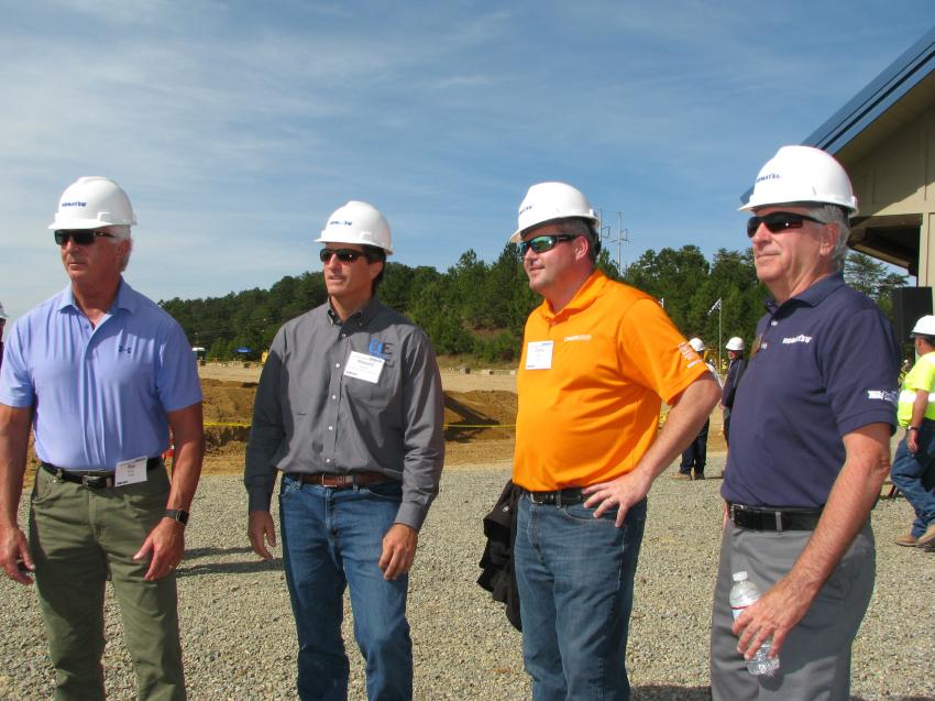 (L-R): Ray Henry, Linder Industrial Machinery; Howard Murrell, Quality Environment Company Inc., Naples, Fla; Chris Wilkes, Linder; and Mike Gavin of Komatsu watch as contractors test-operate machines on the demo site.