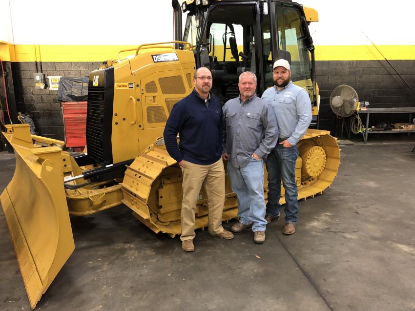 Going over the Cat D5K LGP machine (L-R) are Tracy Skipper, Carolina Cat; Todd Evans, Home Lumber in Eden, N.C.; and Ryan Johnson, Johnson Tree in Stoneville, N.C.
