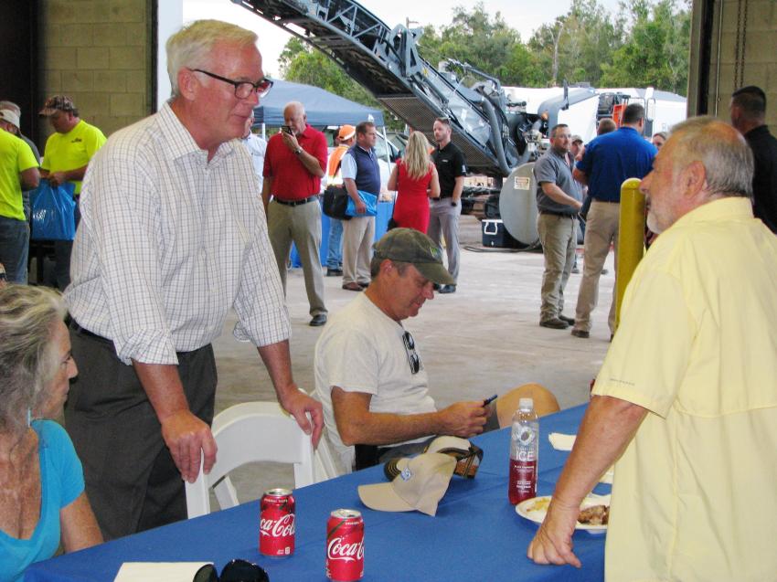John Coughlin (L), president of Linder Industrial Machinery, made his way around to every table during dinner to thank customers for their business and employees for their dedication.