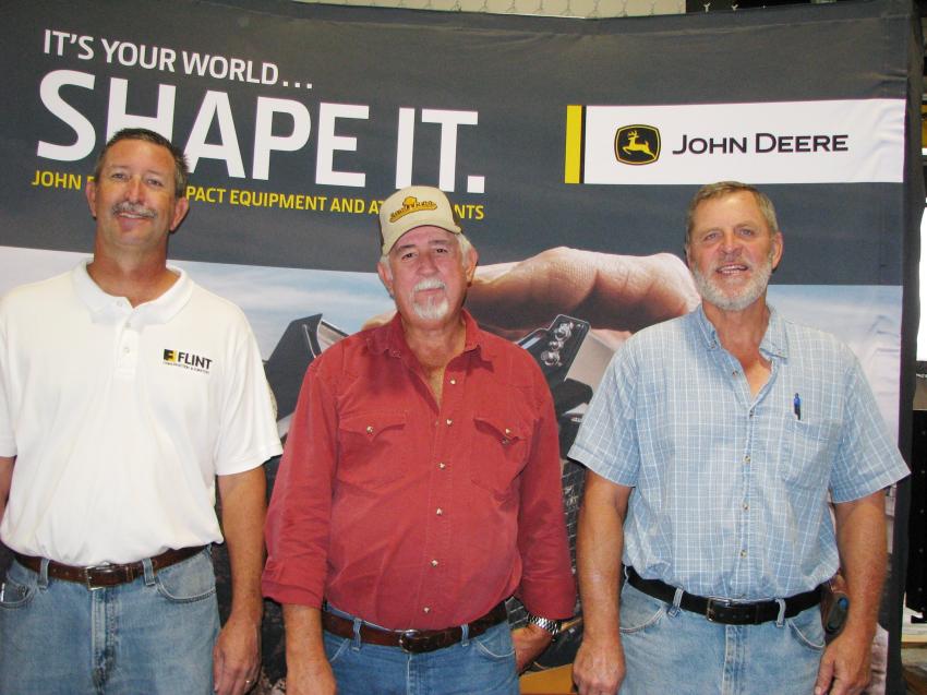 (L-R): Shawn Fishback, Flint customer service adviser, welcomes some municipality guests to the event including Donnie Warren and Will Davis of the city of Hahira, Ga., Public Works Department.