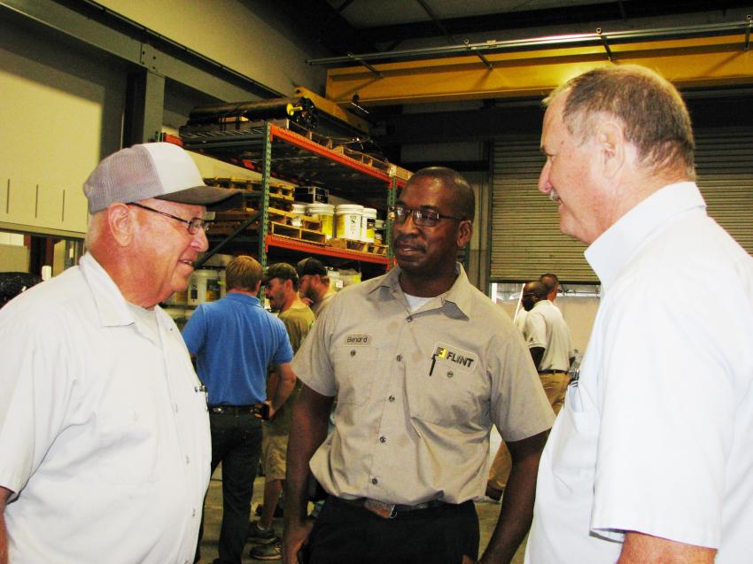 (L-R): Enjoying some post-lunch conversation are Leon Darrell Kinsey, Echols County road superintendent; Bernard Daniels, Flint field service; and Charles Lackey, Flint service manager.