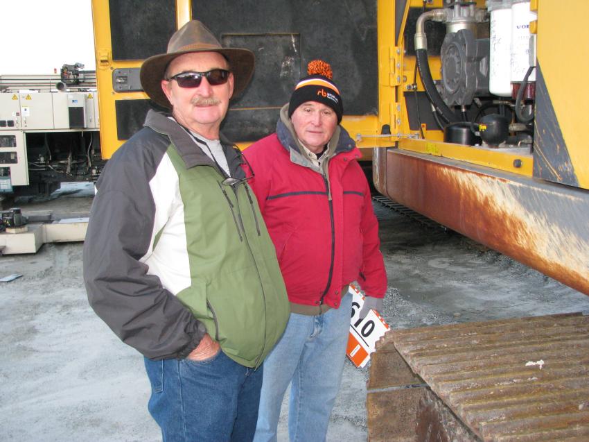 Checking out the hydraulic pump and overall hydraulic system on a Volvo EC340DL excavator are Bob Rose (L) and Ron Rose of Alpha Construction Co., Savannah, Ga. 
