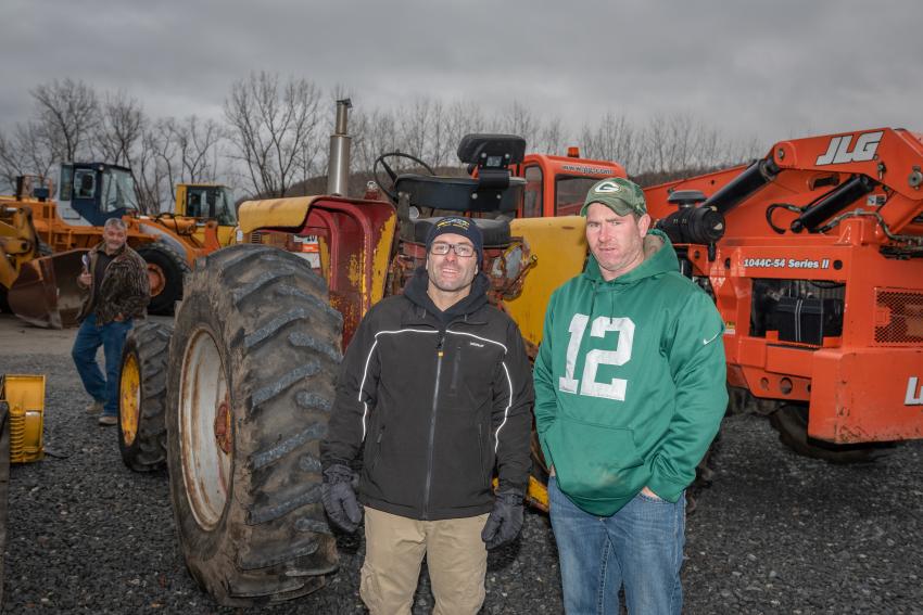 Bob Damiano (L) and Dan Heinz of Nature’s Creations, Tunkhannock, Pa., check out this 1965 Farmall 806 4WD antique tractor.