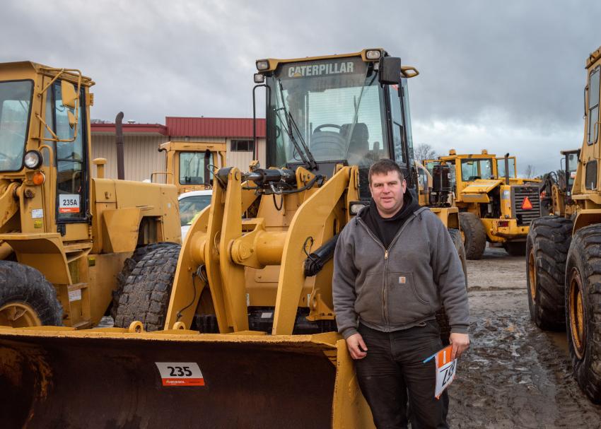 Sean of HGNS Inc. in Albany, N.Y., checks out a 2013 Caterpillar 914G2 wheel loader.