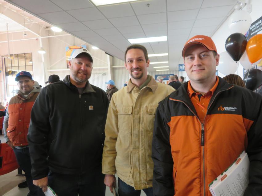 (L-R): Mike Garrard of Midwest Equipment Group and Levi Fry of Aring Equipment are welcomed to the end-of-the-year sale by Ritchie Bros.’ Scott Rozwalka. 

