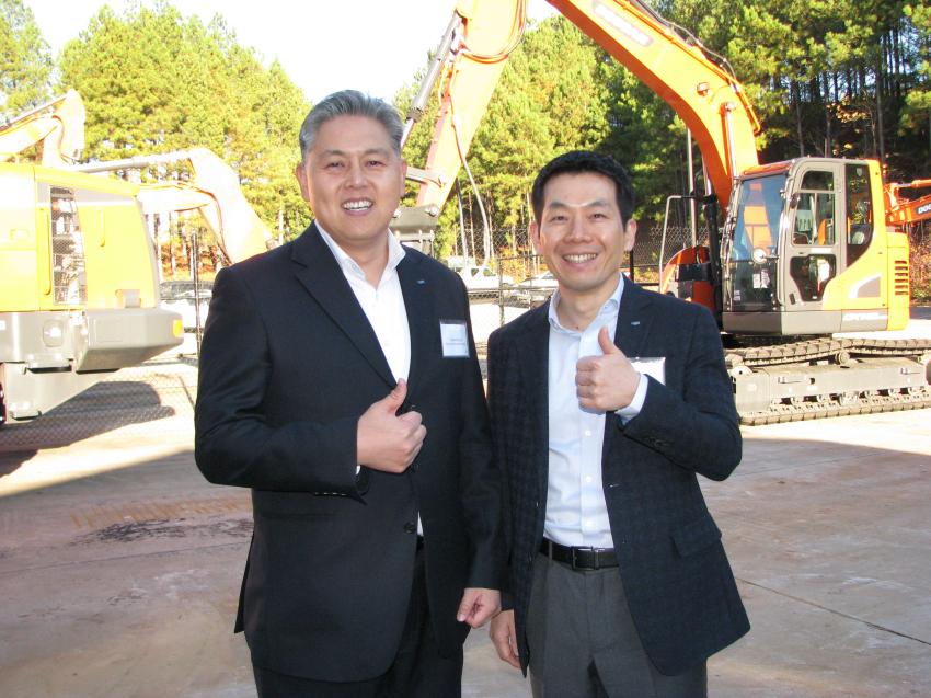 As the ceremony wrapped up, Edward Song (L), CEO of Doosan Infracore North America, and Jongseon Ahn, executive vice president of Doosan Infracore, South Korea, gave it a thumbs-up. 
