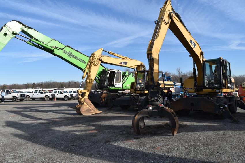 A Sennebogen and Cat material handler with orange peel grapple went on the auction block.