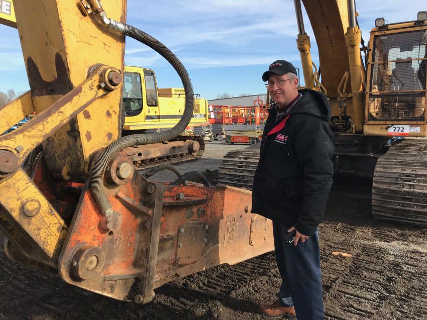 Ron Copenhaven of Lebanon, Pa., checks out an excavator with an NPK hammer that he needs for some demo work.