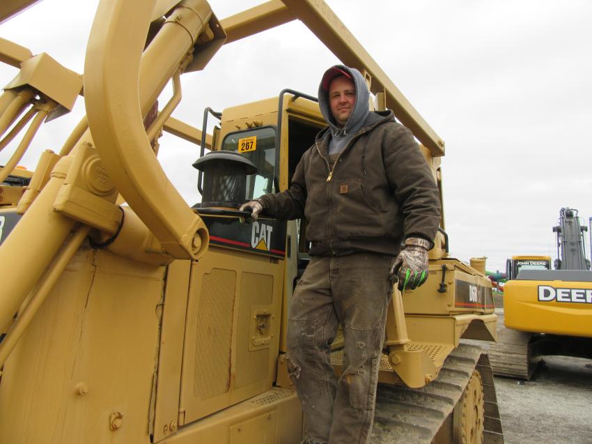 Trent Riggs of Riggs Farms considers a bid on a Cat D6R XL dozer.
