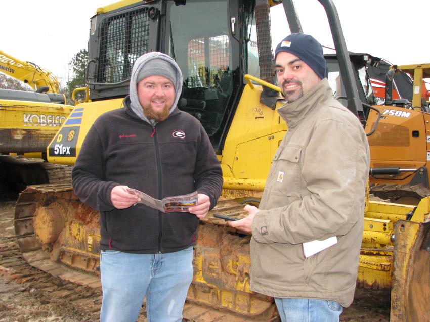 Reading up on some of the miscellaneous items of common interest are Brandon Caldwell (L) of Proven Solutions, Newnan, Ga., and Charles Davis, independent contractor, also based in Newnan, Ga.
