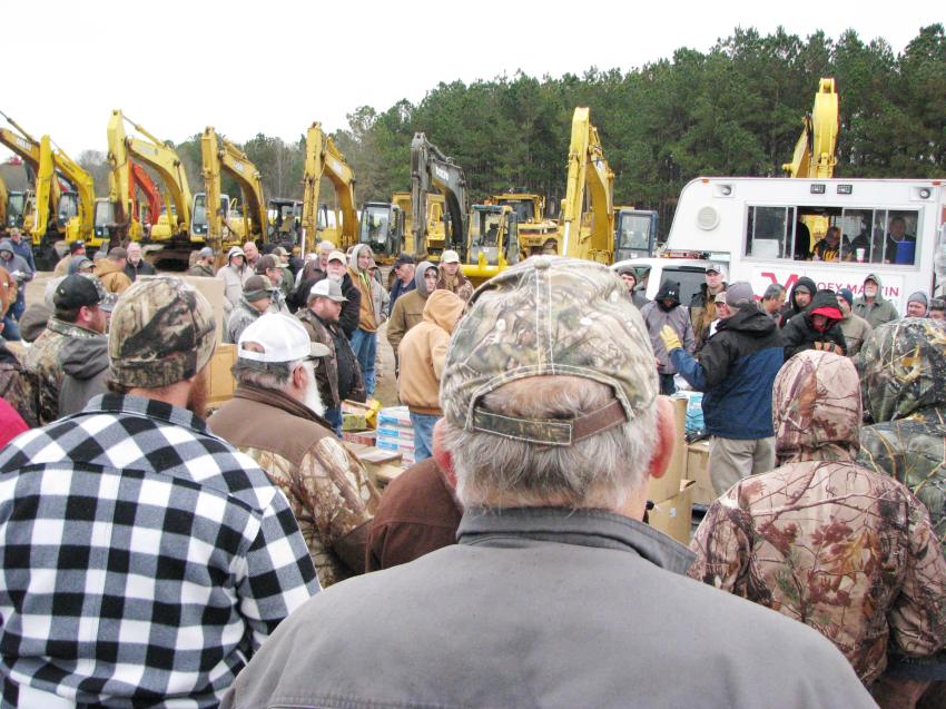Registered bidders swarm around the auction truck as the sale gets under way on Dec. 7. 
