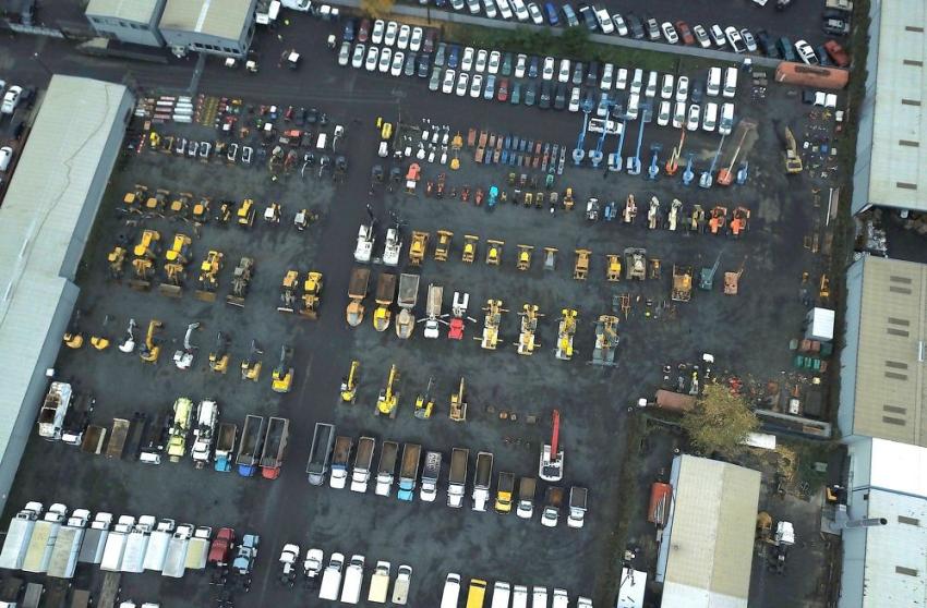 A snapshot by drone of J. Stout Auctions’ 6-acre yard, filled with heavy equipment, commercial trucks and government fleet. 
(Perfect Shot Filming photo)