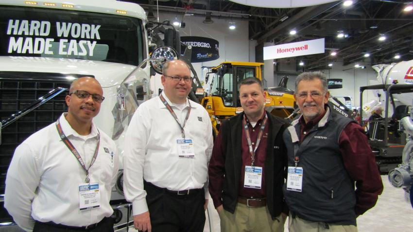 (L-R): Gerald Saunders and Brian Selvy of Volvo Trucks stand with Chris Connolly and Joel Escalante of Volvo Construction Equipment in front of a Volvo VLT quint axle truck and a wheel loader with the new 2.0 update. Both companies work seamlessly together to create more fluent solutions for the operator.