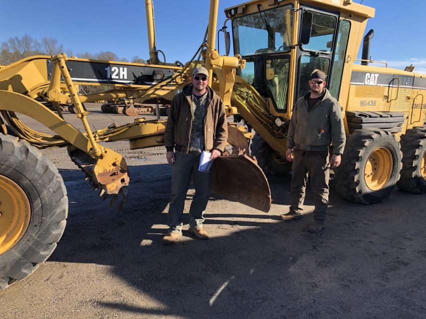 Adam (L) and Mark Boswell of Southern Woodchucks in Piedmont, S.C., came to the auction for the attachments, excavators and this motorgrader to grow their business.
