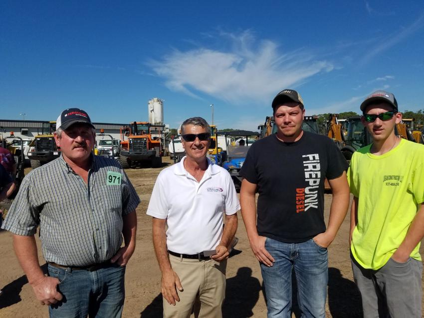 Todd Mobley (L), Adam Spragen (third from L), Tate Mobley (R), all of Logan Construction, Rushylvania, Ohio, stand with Dean Schettino of Smart Credit.
