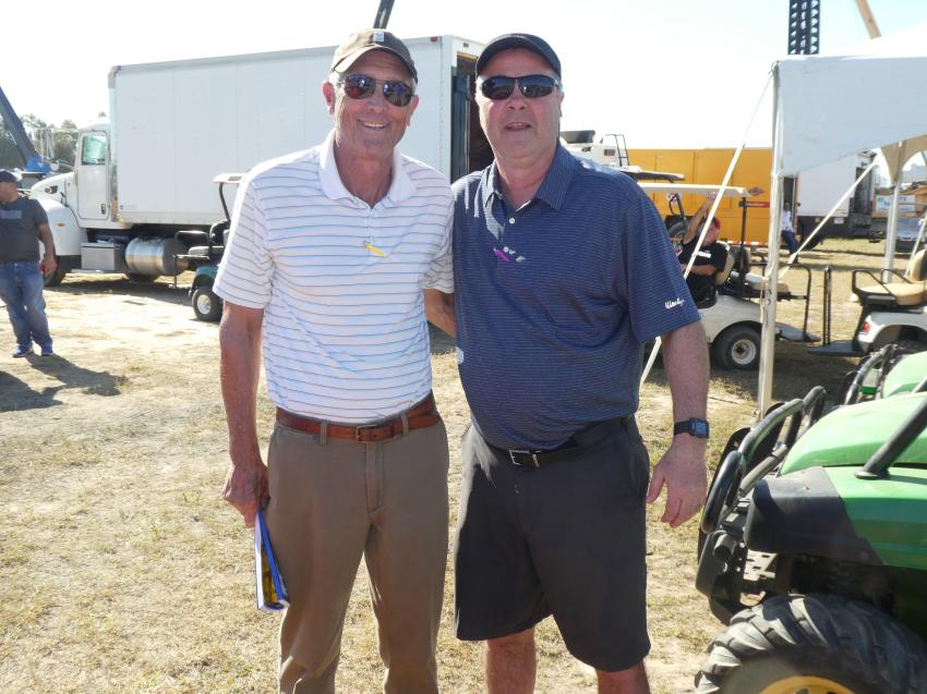 Tollie Young (L), Creekview Corporation, Orlando, Fla., and Lexington, Ky., and Bill Yurkovic, corporate used equipment manager, Cleveland Brothers, Harrisburg, Pa., take in the auction and the Florida sun.