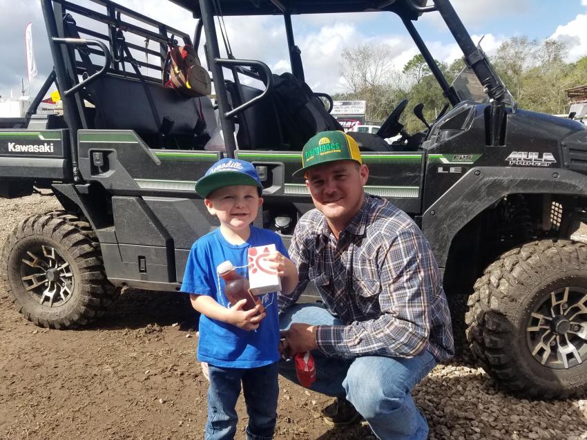 Paxtyn and his dad, Clay O’Berry, Clay O’Berry Ag Performance, St. Cloud, Fla., are excited to do some equipment shopping at the Jeff Martin auction.