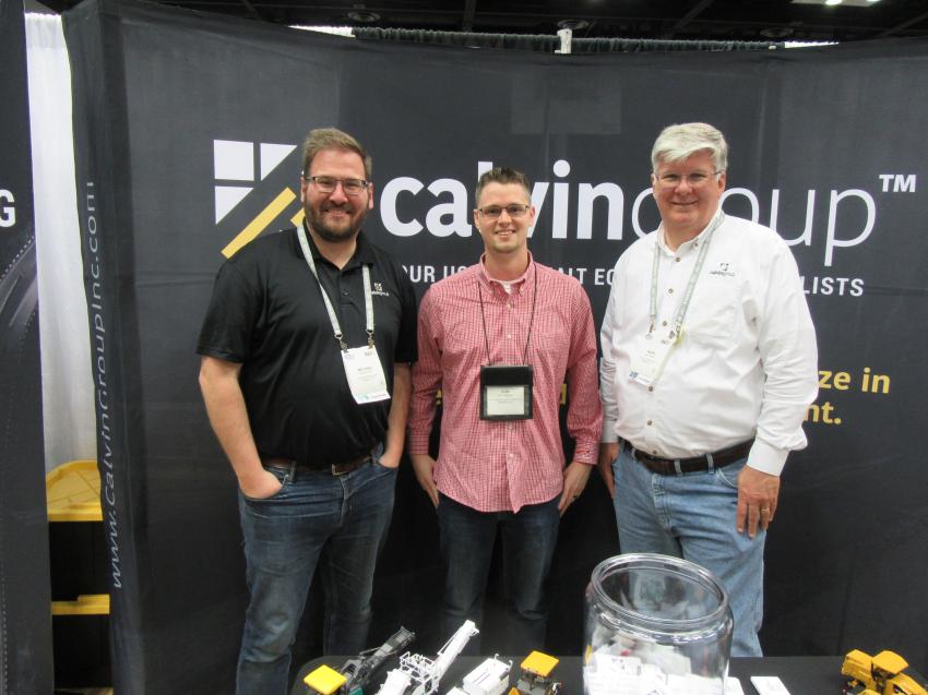 Don Gallagher of Gallagher Asphalt Corporation (C) catches up with The Calvin Group Inc.’s Michael Pentz (L) and Mark Pentz.