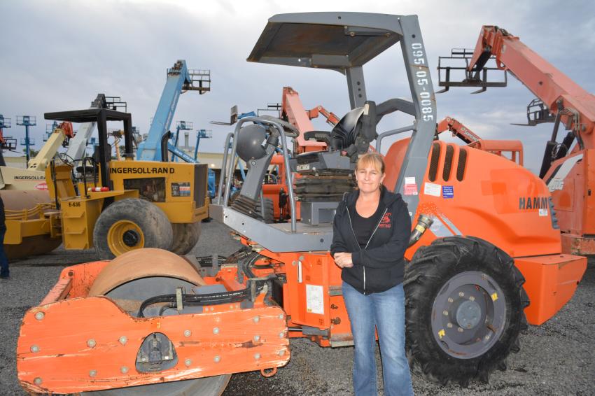 Karen Abbott of Abbott Equipment Sales travels to Houston annually for their winter sale rather than attend the Florida auctions. She said the smaller crowds allow her to better inspect the equipment she is interested in buying, like this Hamm 3205 vibratory roller.
