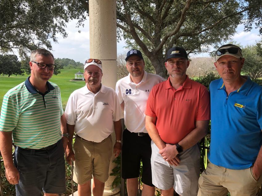 (L-R) are Ryan Hayes of Hayes Tractor in Baxter, Minn.; Mike Hayes of Hayes Tractor, Marco Island, Fla.; Rasmus Stokholm of Hansen Shipping, London, England; Randall Matcek of Mustang Cat, Houston, Texas; and Gary Jarvis of Carolina Cat, Charlotte, N.C.