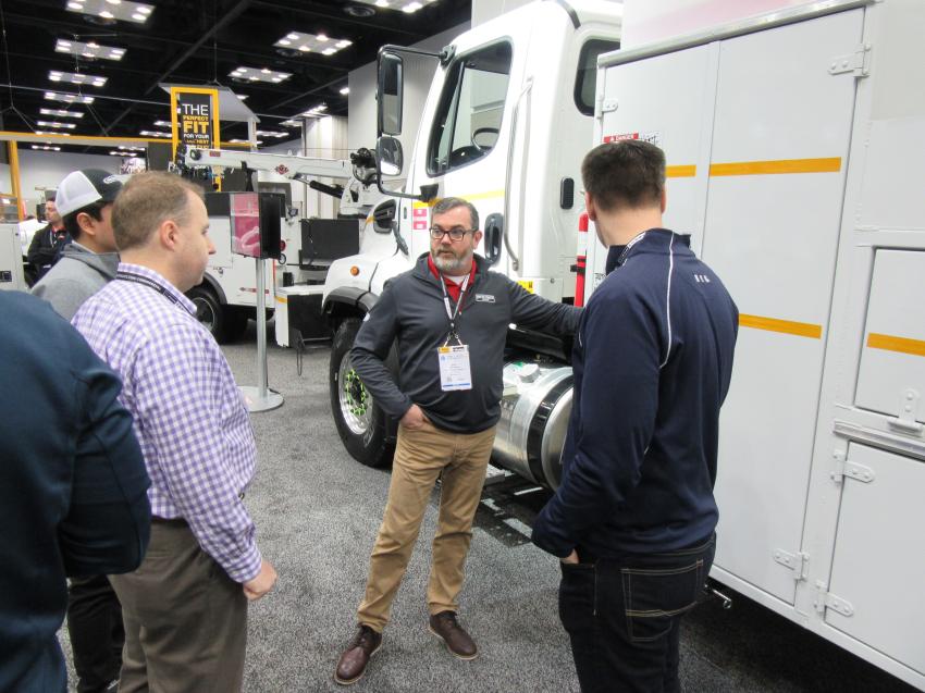 Eric Norman of Auto Truck Group talks with attendees about the company’s Kargo Master packages.
